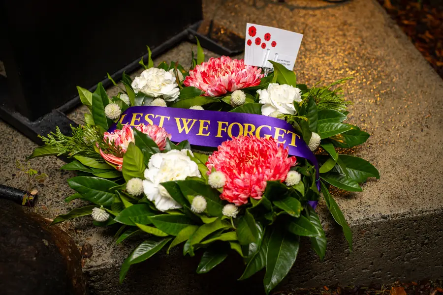 A “Lest We Forget” wreath of poppies laid at the war memorial.