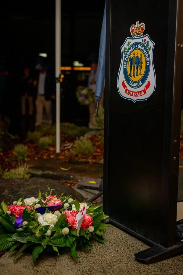 Floral tributes at the base of the RSL Sub-Branch memorial.