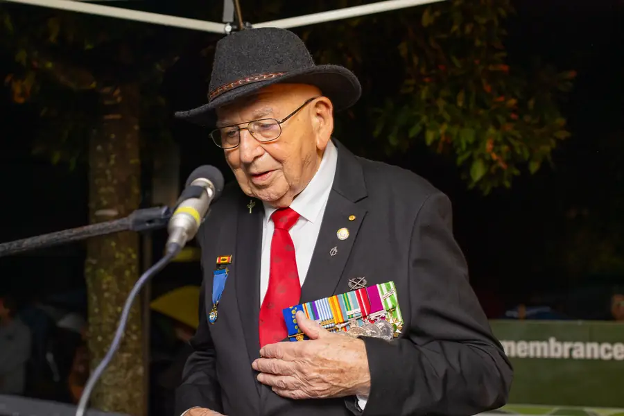 A veteran, hand on heart, during the ANZAC Day commemoration.