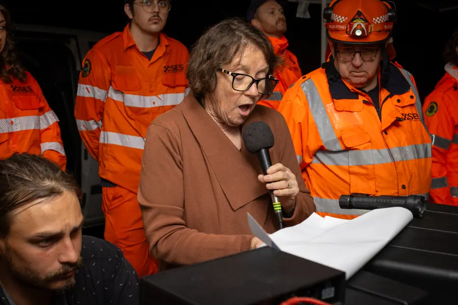 A reading given at the microphone during the commemorative service.