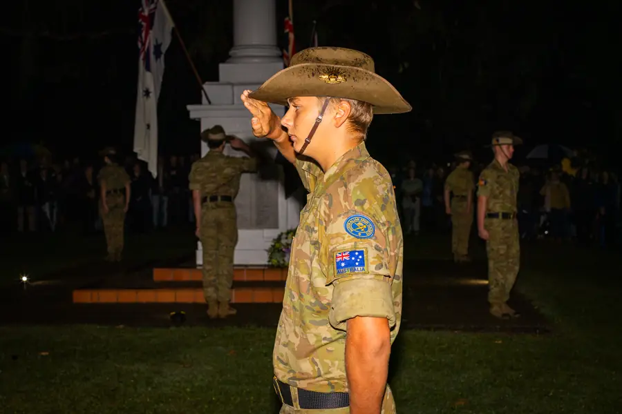 Two veterans in medals and slouch hats at the commemoration.